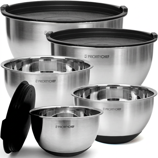 Stainless steel mixing bowl set with black lids on white background